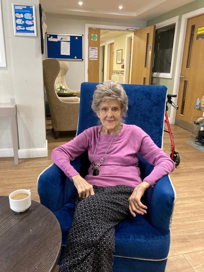 older lady sat in a n armchair